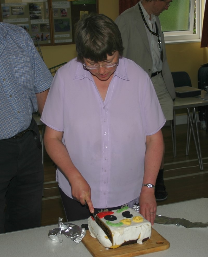 Cathy Warrell cutting the birthday cake at our 30th anniversary meeting on 24th June 2006