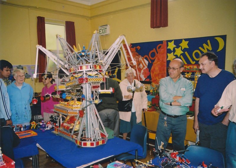 Santiago Plicio (standing in light blue shirt) demonstrates one of his fairground rides at our 28th exhibition on 14th October 2006 at Eltham United Reformed Church