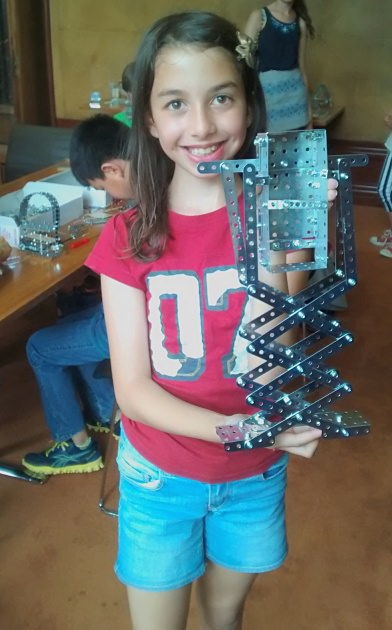 One of the budding architects shows off her clever scissor lift mechanism